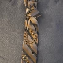 Striped tie necklace with gold leaf detail from the current Facebook drop.